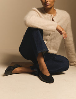 Black leather high vamp ballet flats on model