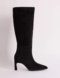 Side view of black suede pointed knee-high boot