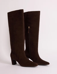 Brown suede knee-high boots with pointed toe