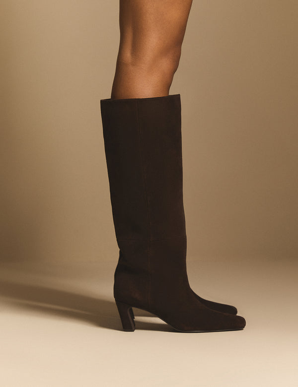 Side view of brown suede knee-high boots