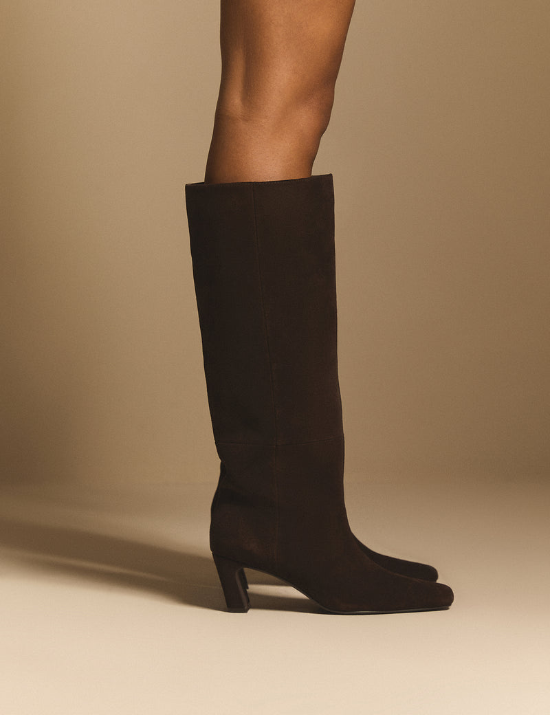 Side view of brown suede knee-high boots