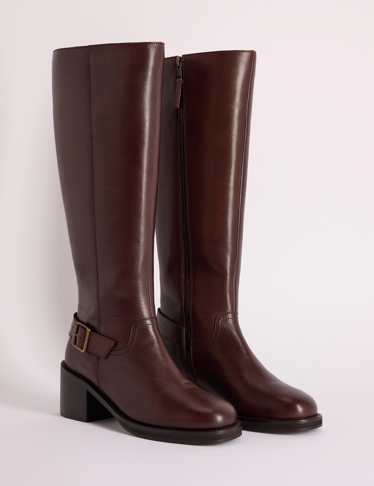 Brown leather knee-high boots with buckle detail