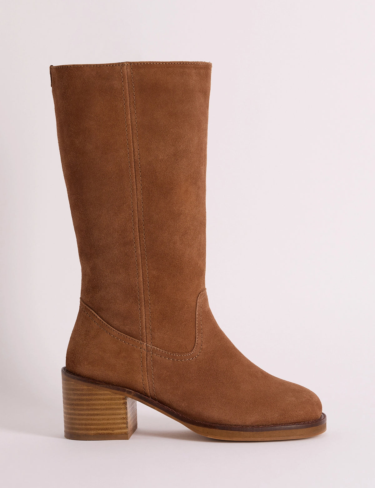 Side view of tan suede boot with a block heel