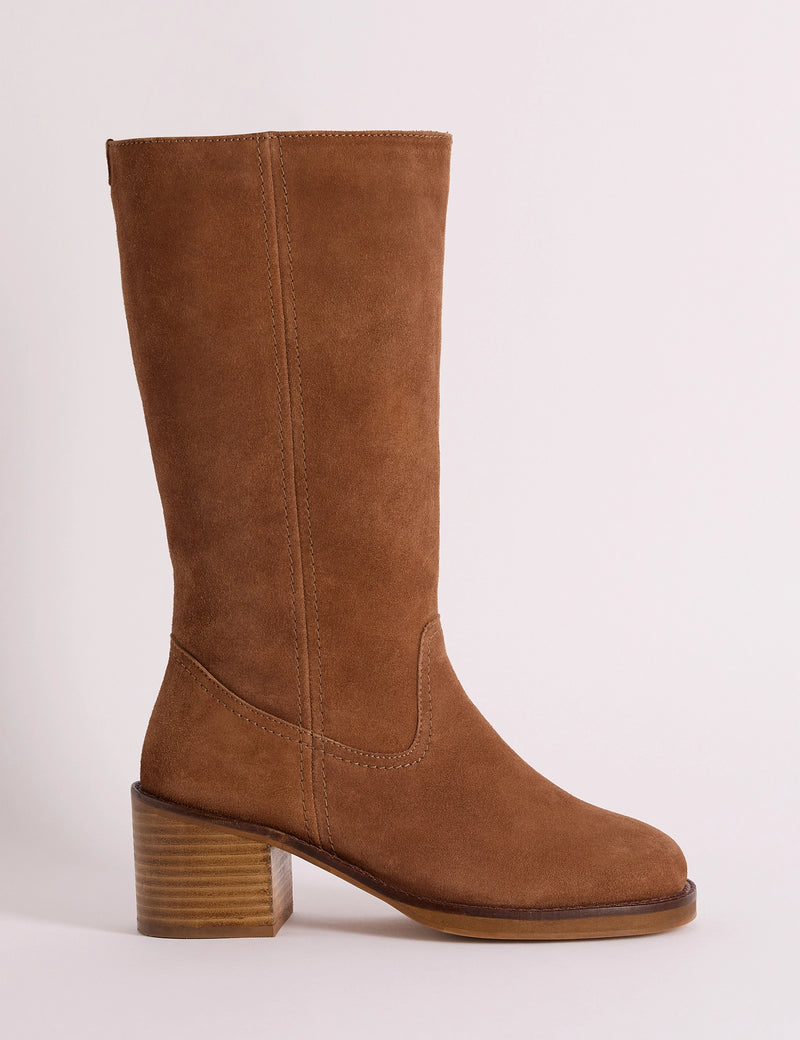 Side view of tan suede boot with a block heel
