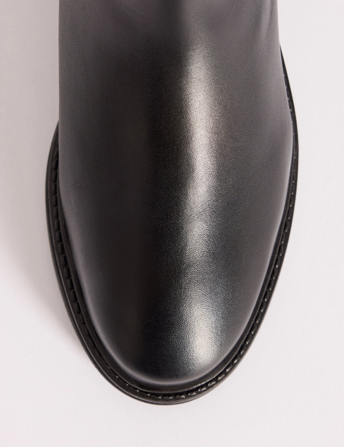 Round toe detail on black leather Chelsea boots