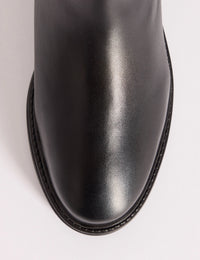 Round toe detail on black leather Chelsea boots