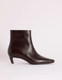 Side view of brown leather kitten heel ankle boot