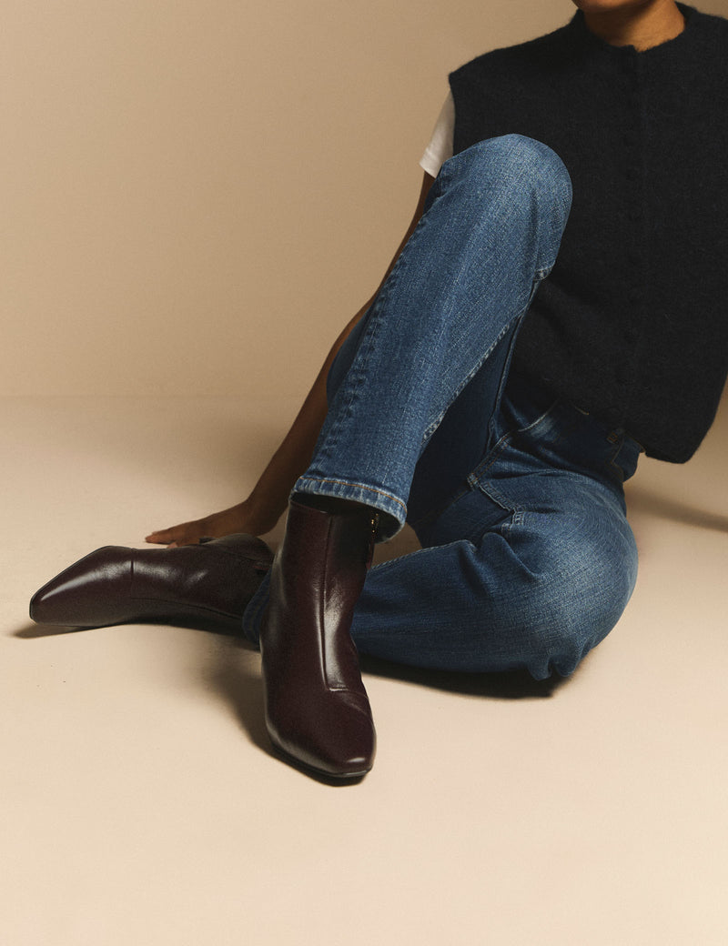 Brown leather kitten heel boots worn with jeans