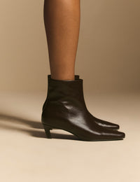 Side view of brown leather kitten heel ankle boots