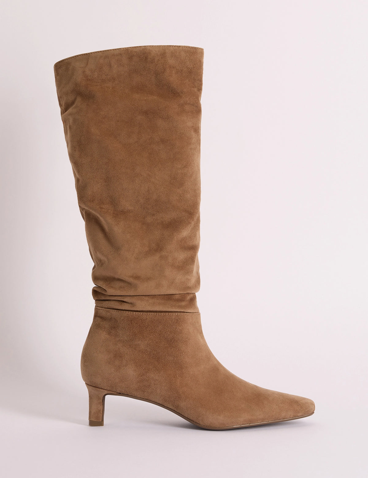 Side view of tan suede slouch knee-high boot