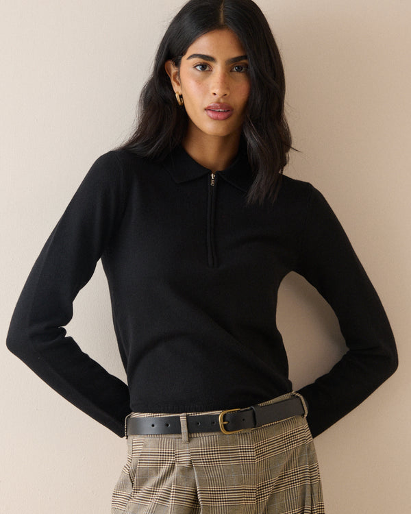 Black half zip polo top with long sleeves