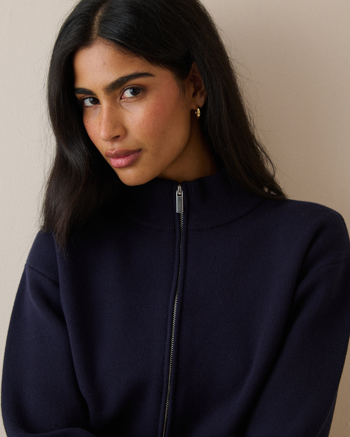High neck zip detail on navy knitted jacket