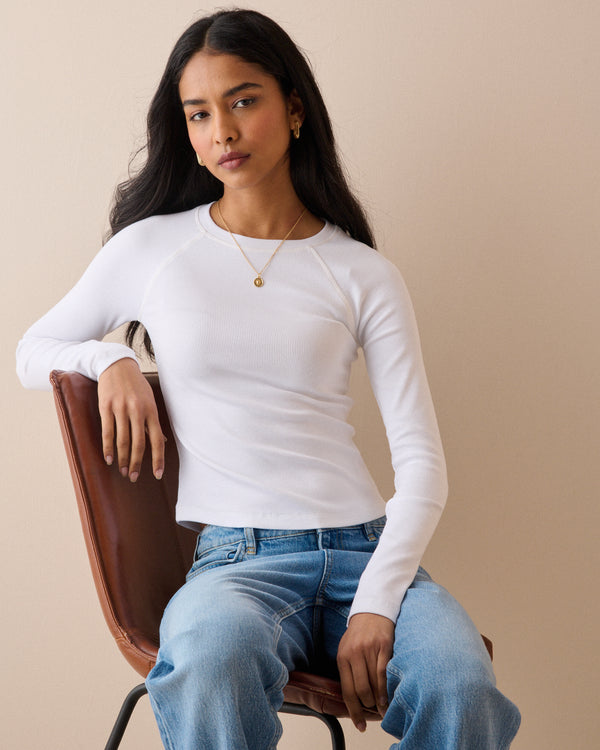 White ribbed top with long raglan sleeves