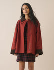Red barn coat with brown cord collar and cuffs