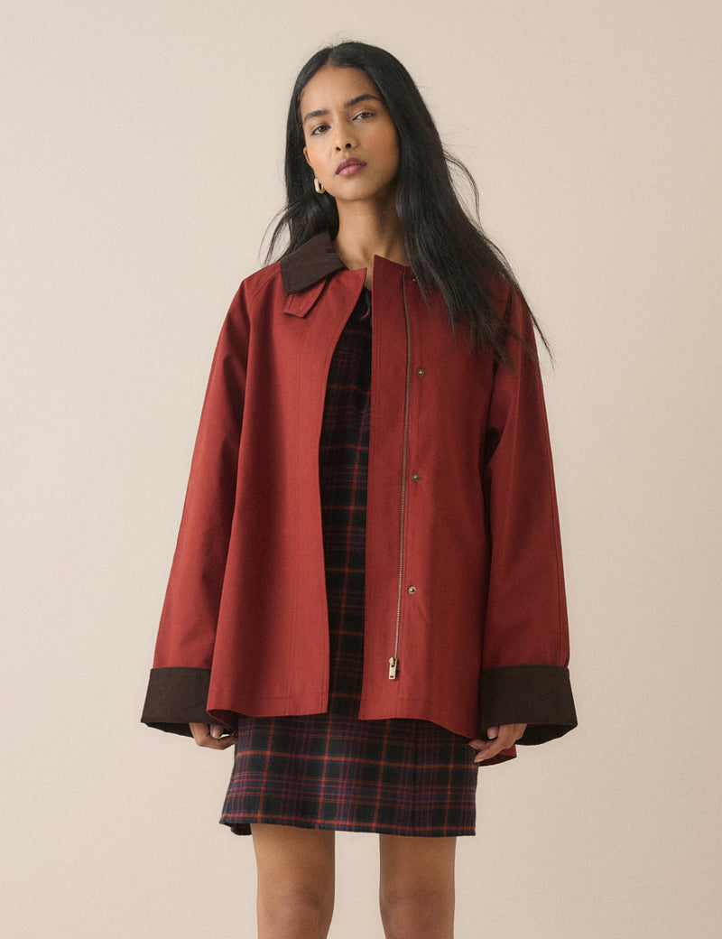Red barn coat with brown cord collar and cuffs