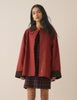 Red barn coat with brown cord collar and cuffs