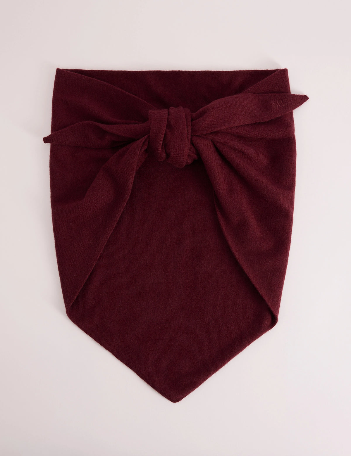 Burgundy wool-blend triangle scarf tied into a knot