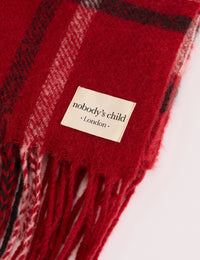 Logo patch detail on red tartan blanket scarf