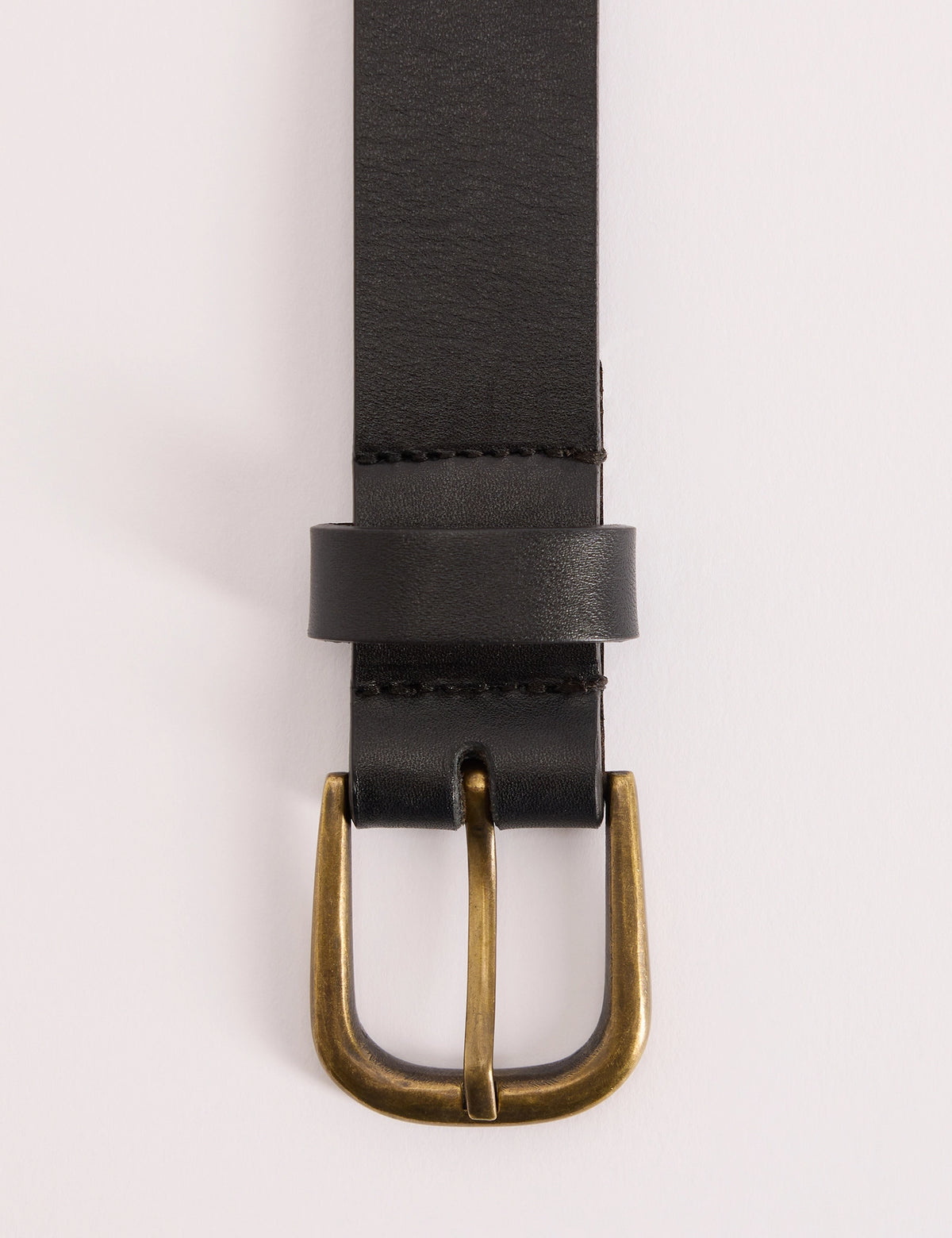Gold-toned buckle detail on black leather belt