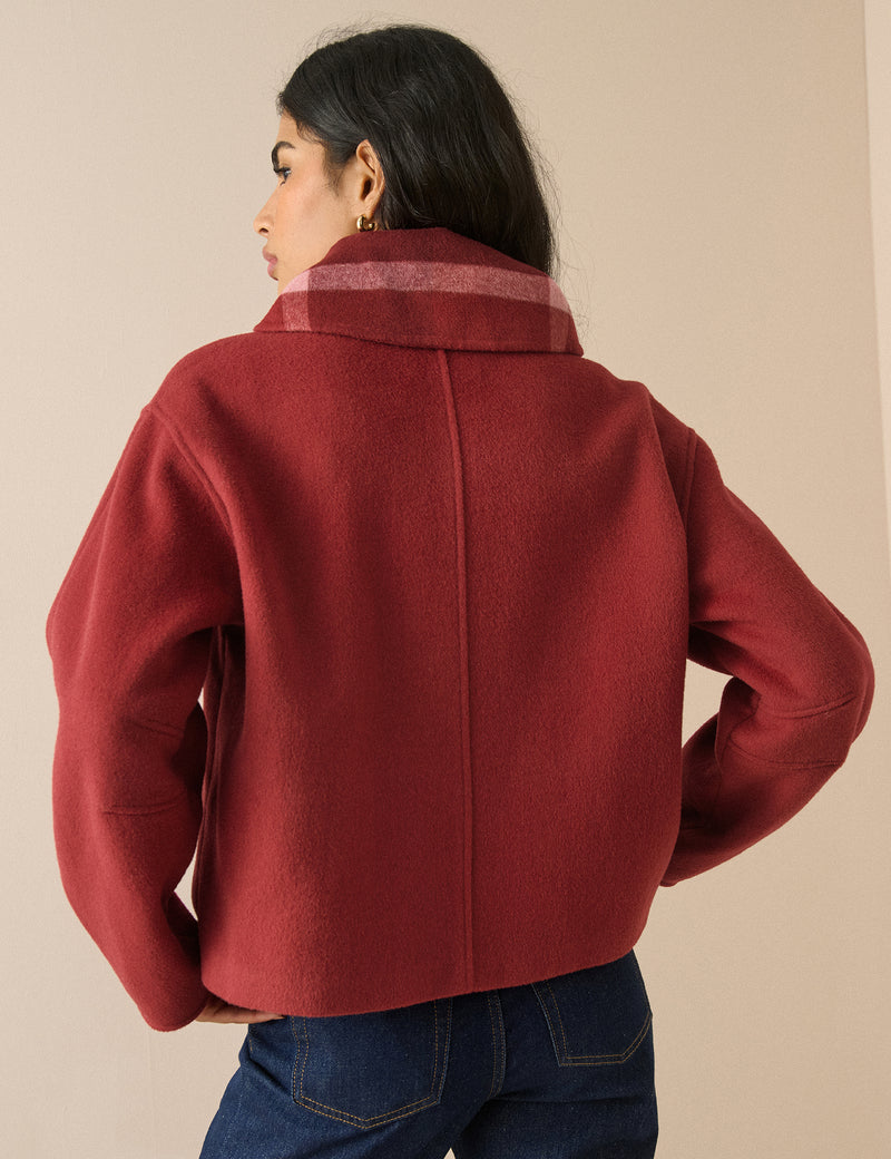 Back view of red wool-blend tie neck jacket