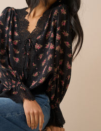 Lace trim detail on black floral blouse