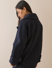 Back view of navy wool-blend pea coat
