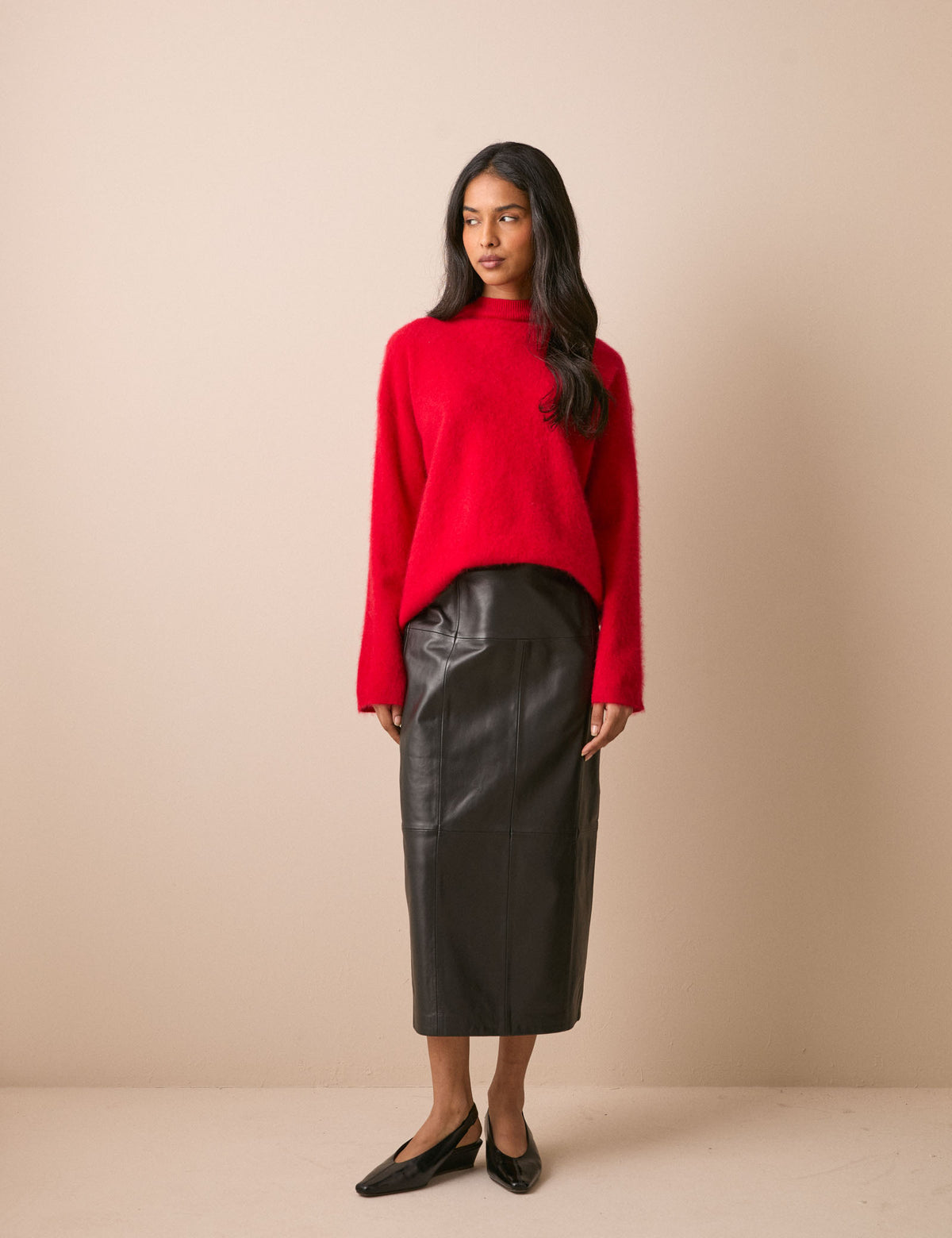 Front view of black leather column skirt