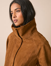Funnel neck detail on tan suede jacket