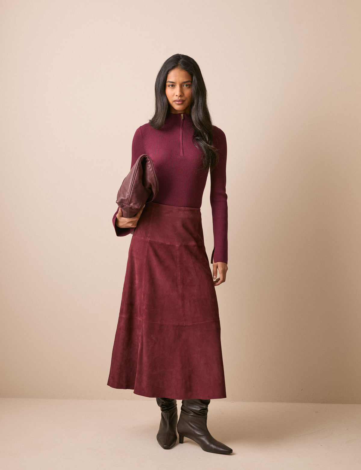 Front view of burgundy suede midi skirt