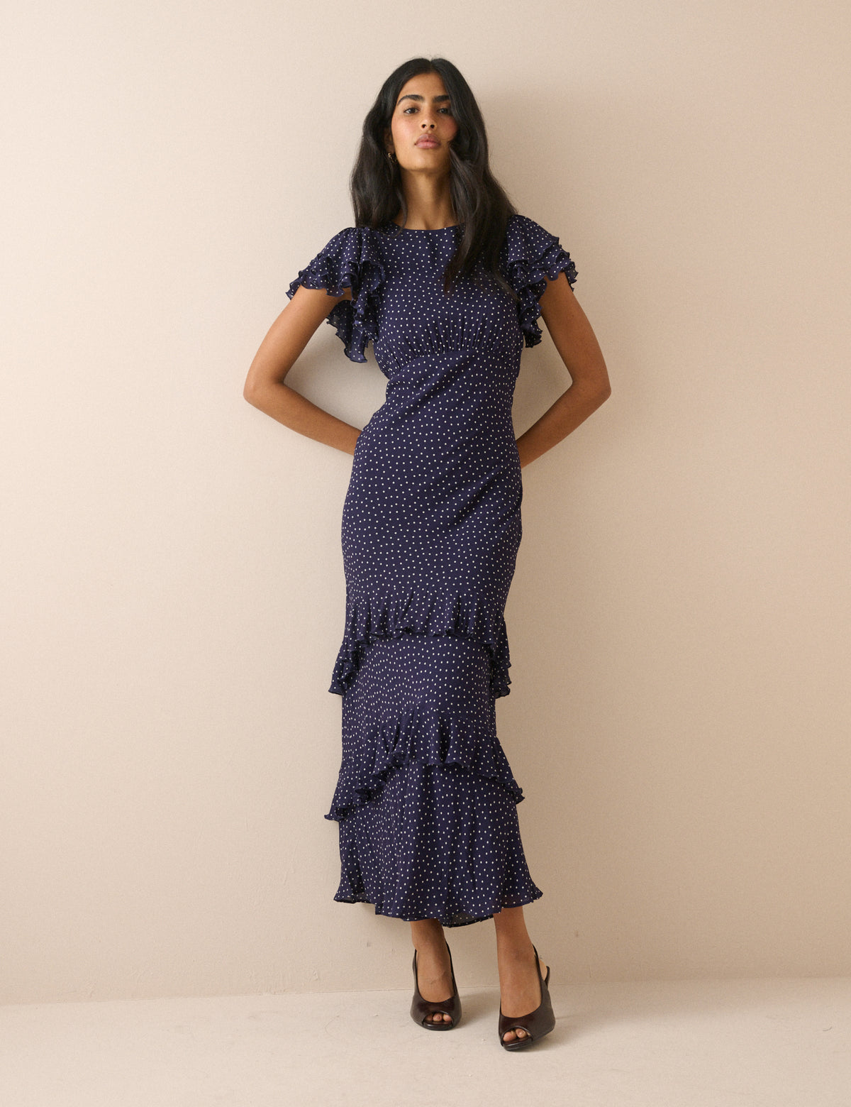 Navy polka dot midaxi dress with ruffle sleeves