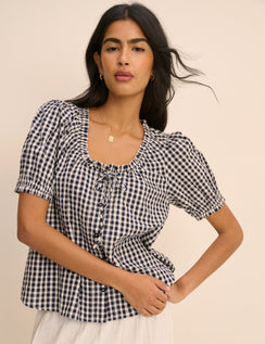 Blue gingham blouse with puff sleeves