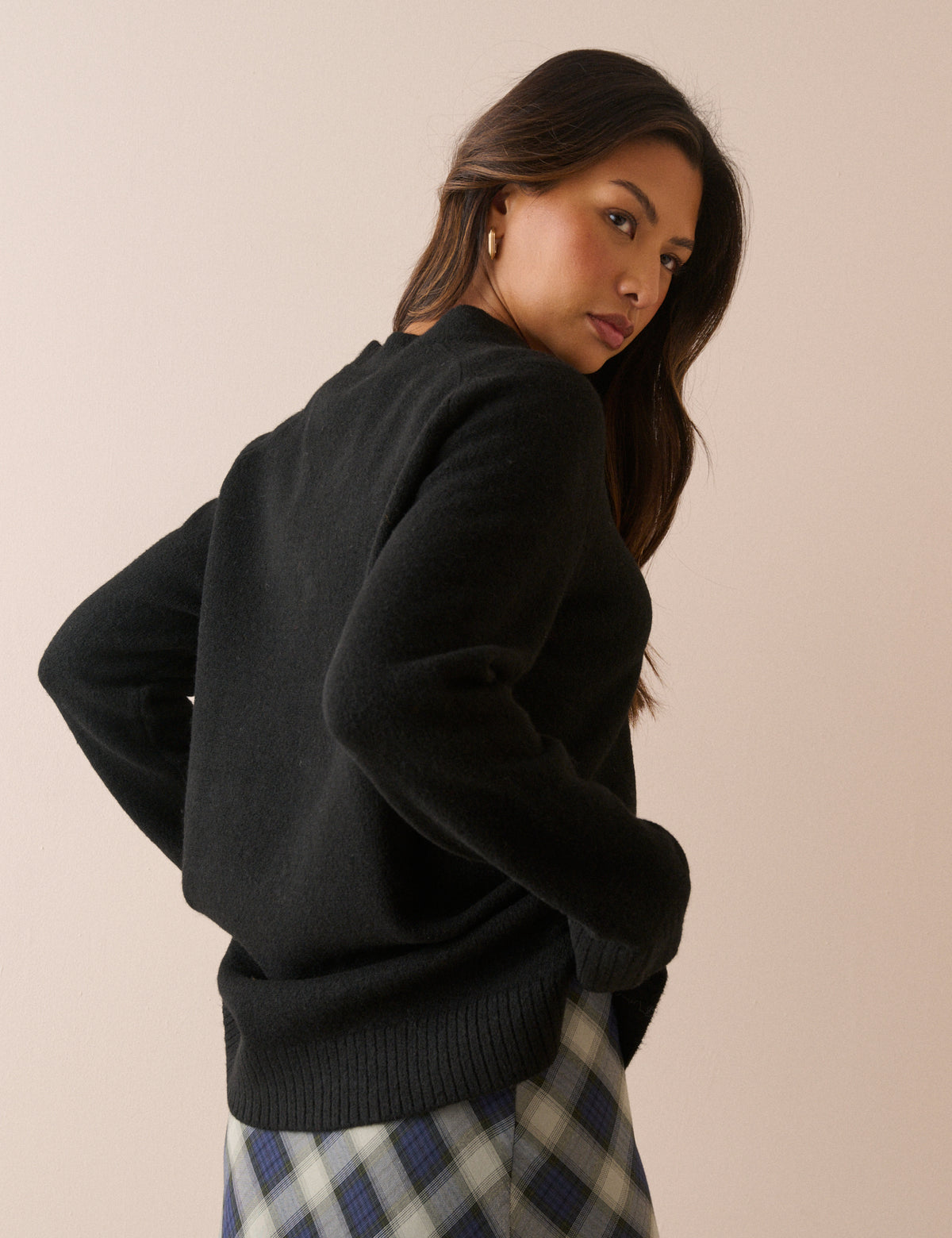 Back view of black longline jumper