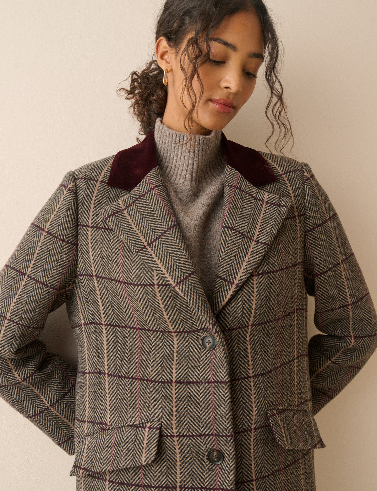 Collar detail on brown herringbone wool-blend coat