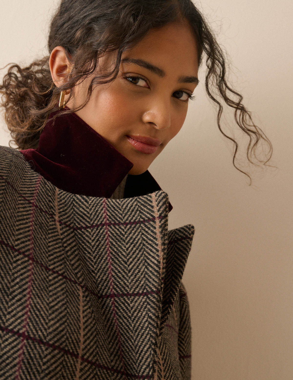 Collar detail on brown herringbone wool-blend coat