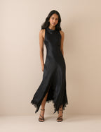Black satin maxi dress with asymmetric lace hem