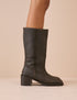 Side view of dark brown suede boots with a block heel