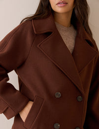 Collar detail on brown wool-blend pea coat
