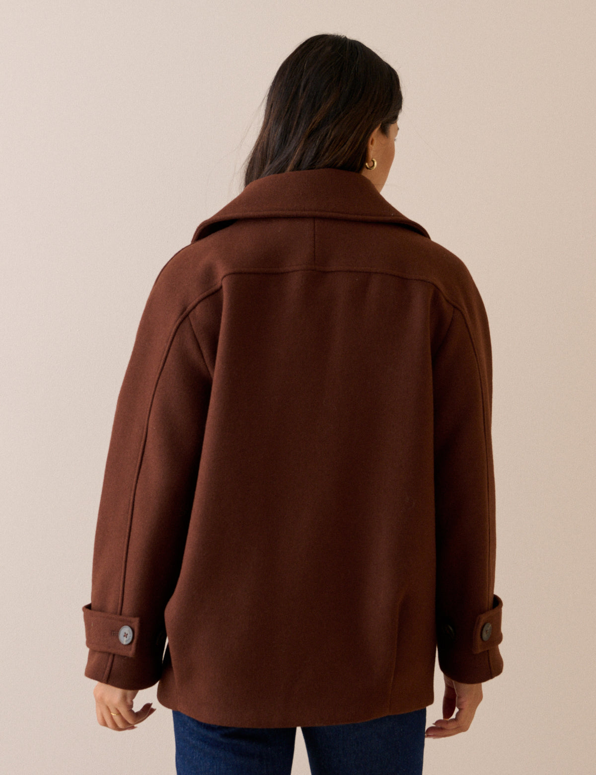 Back view of brown wool-blend pea coat