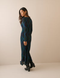 Back view of navy tartan midi dress with long sleeves