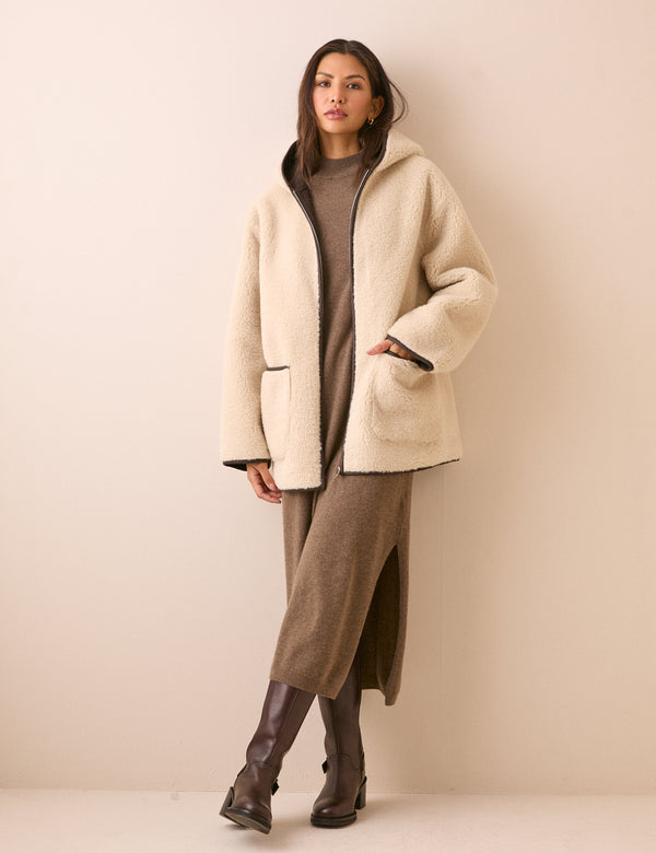 Front view of cream faux shearling hooded jacket