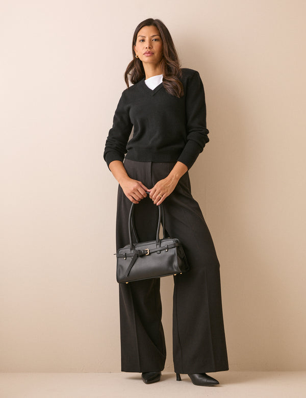 Black V-neck jumper with shoulder pads