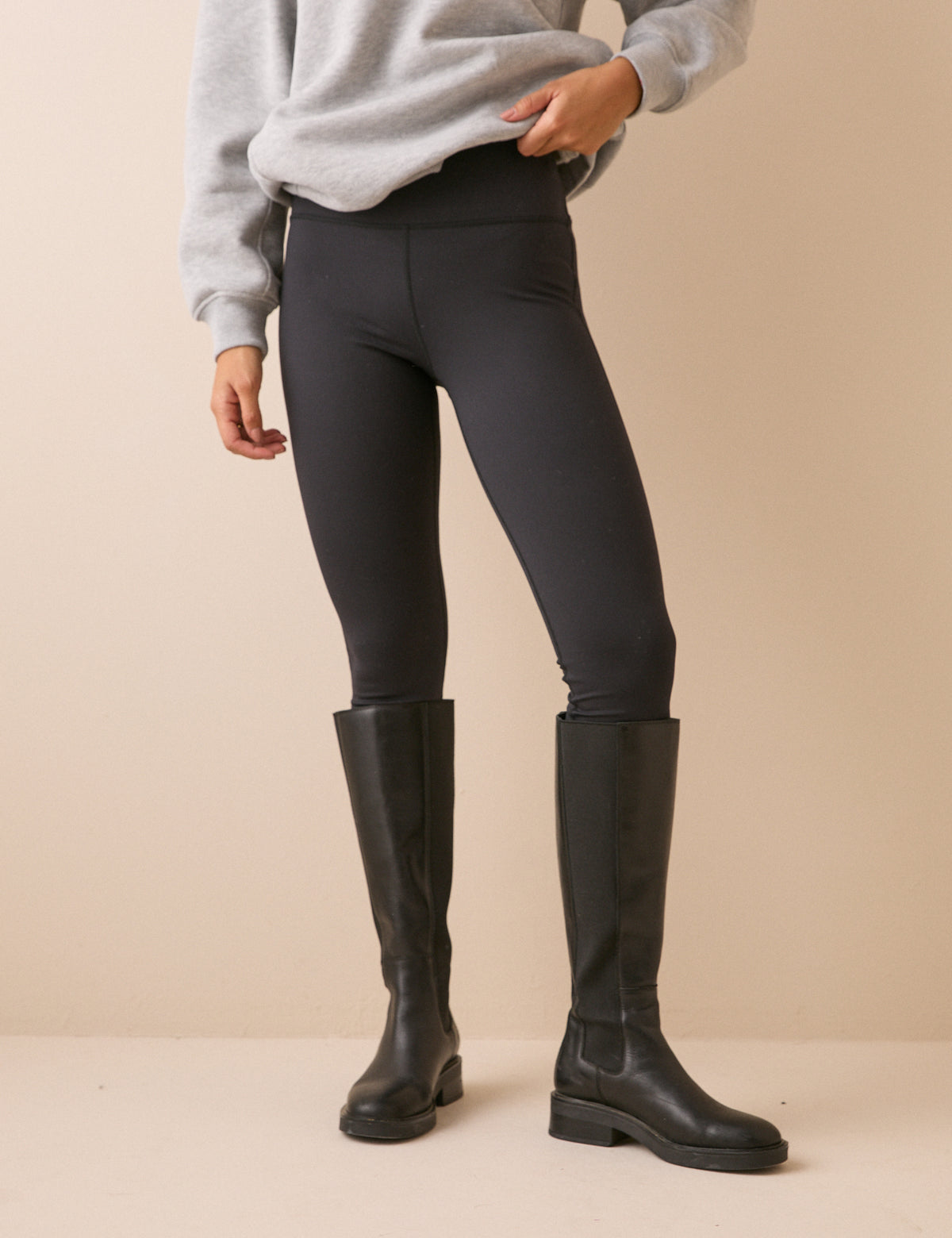Front view of black high-waisted jersey leggings