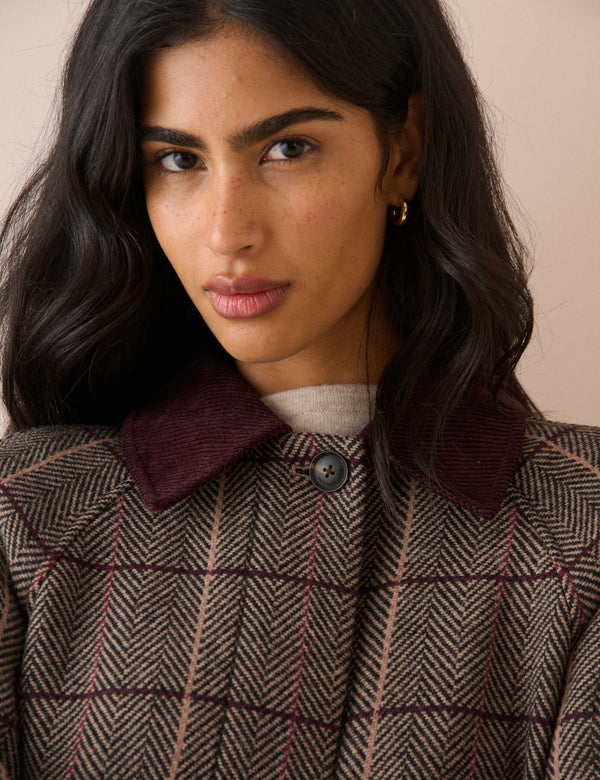 Collar detail on brown herringbone wool-blend coat
