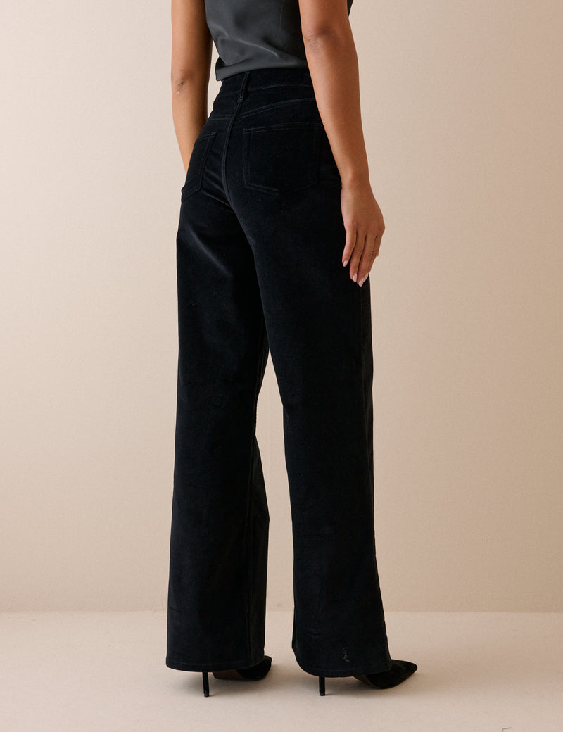 Back view of black velvet wide leg jeans